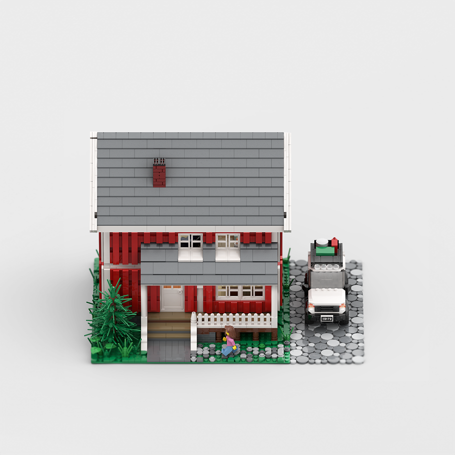 Toy-brick house illustration representing our real estate design focus